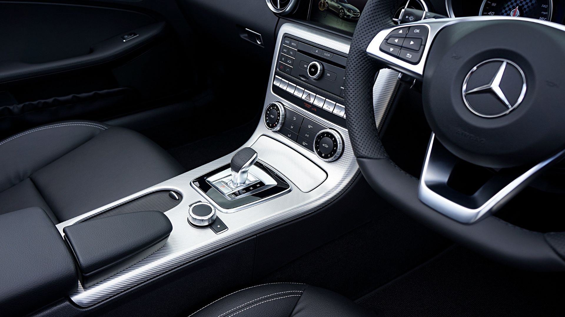 Mercedes-Benz interior with modern dashboard, gear shift, and steering wheel